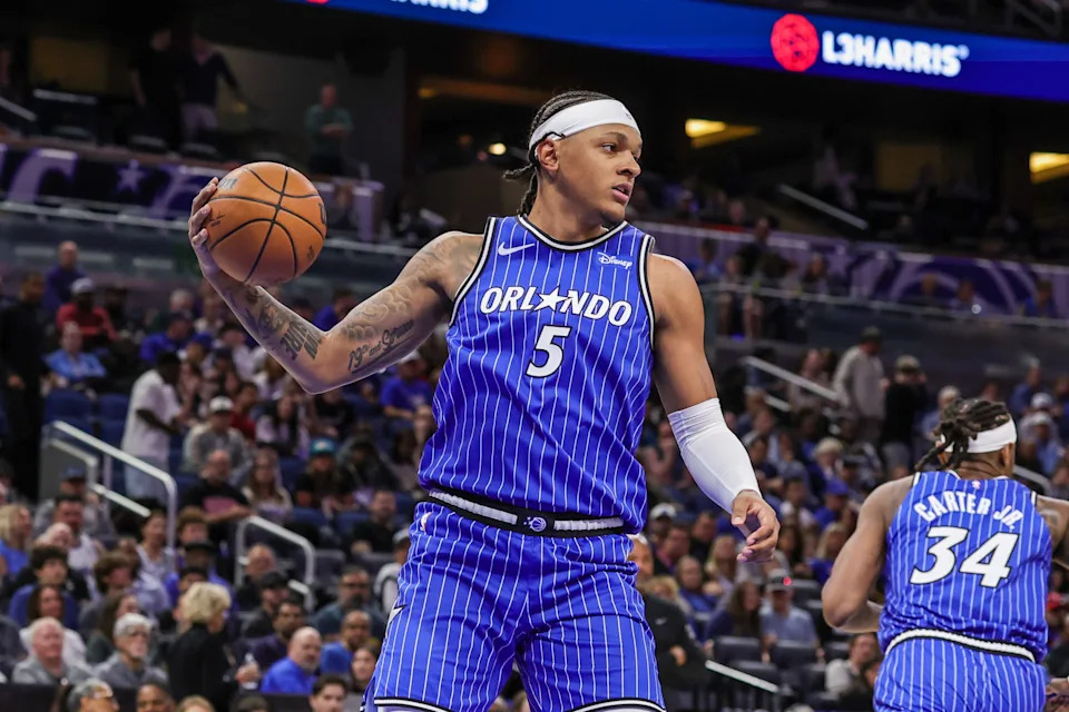 Mar 1, 2026; Orlando, Florida, USA; Orlando Magic forward Paolo Banchero (5) grabs the rebound during the first quarter against the Detroit Pistons at Kia Center. Mandatory Credit: Mike Watters-Imagn Images
