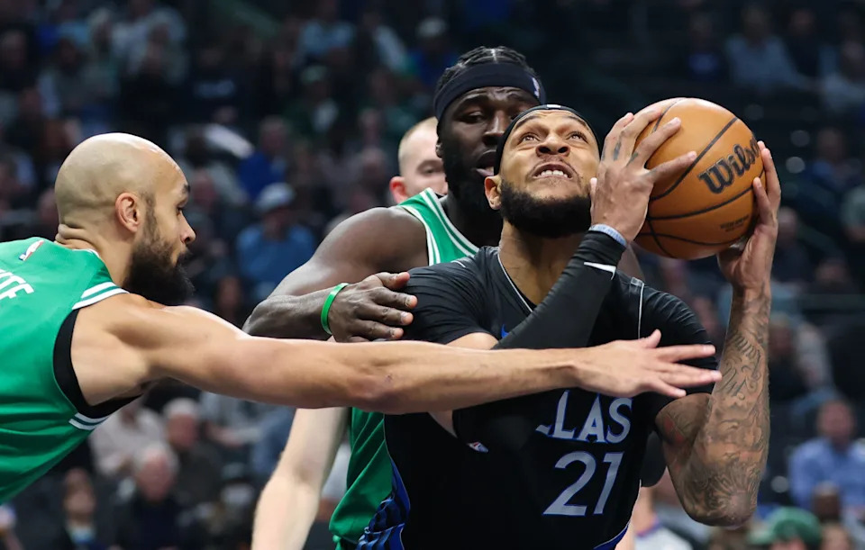 Feb 3, 2026; Dallas, Texas, USA; Dallas Mavericks forward Daniel Gafford (21) looks to score as Boston Celtics guard Derrick White (9) defends during the first quarter at American Airlines Center. Mandatory Credit: Kevin Jairaj-Imagn Images