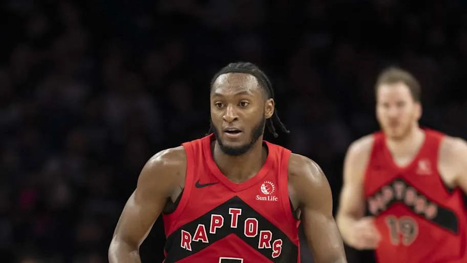 Toronto Raptors guard Immanuel Quickley dribbles the ball against the Minnesota Timberwolves