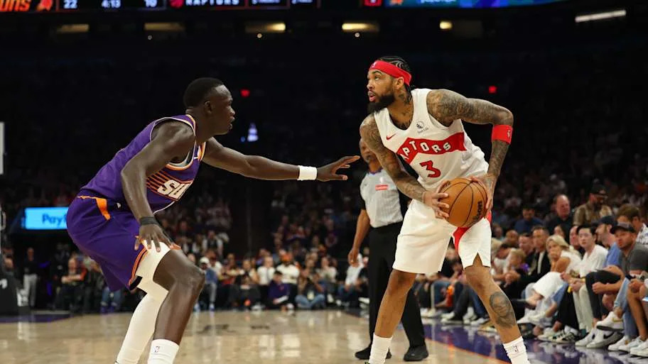 Toronto Raptors forward Brandon Ingram looks to pass against Phoenix Suns center Khaman Maluach