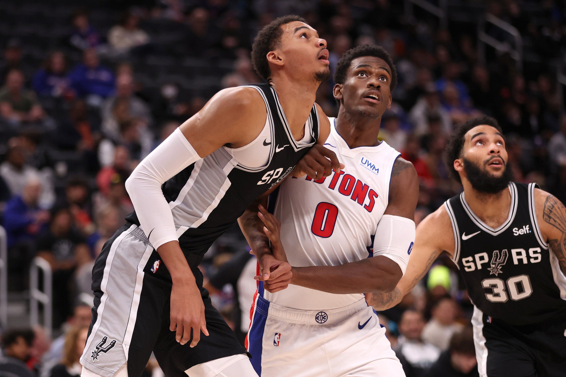 DETROIT, MICHIGAN - JANUARY 10: Jalen Duren #0 of the Detroit Pistons blocks out Victor Wembanyama #1 of the San Antonio Spurs duirng a during the first-half free throw at Little Caesars Arena on January 10, 2024 in Detroit, Michigan. NOTE TO USER: User expressly acknowledges and agrees that, by downloading and or using this photograph, User is consenting to the terms and conditions of the Getty Images License (Photo by Gregory Shamus/Getty Images)