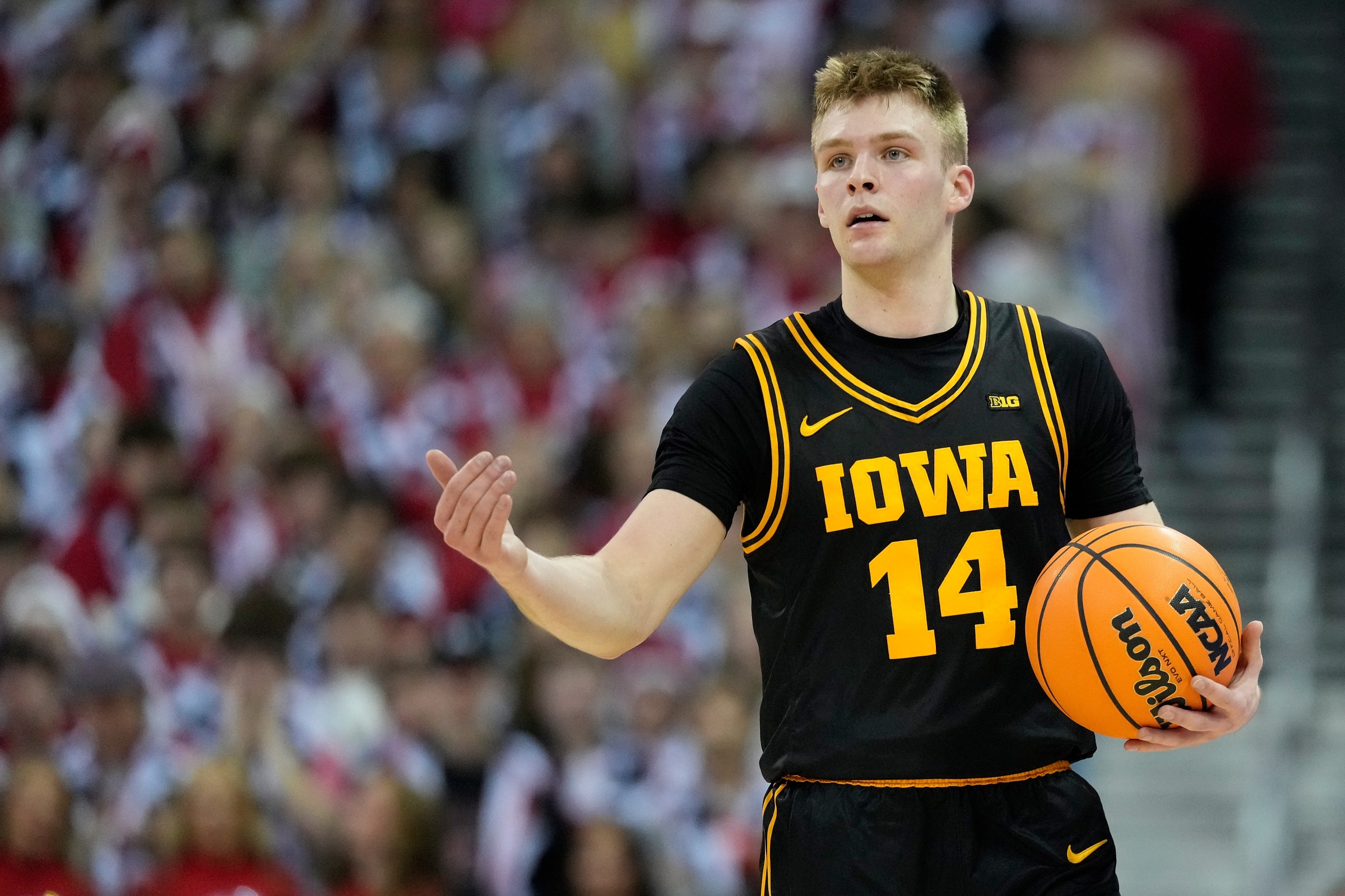 MADISON, WISCONSIN - FEBRUARY 22: Bennett Stirtz #14 of the Iowa Hawkeyes dribbles up court during the first half against the Wisconsin Badgers at Kohl Center on February 22, 2026 in Madison, Wisconsin. (Photo by John Fisher/Getty Images)