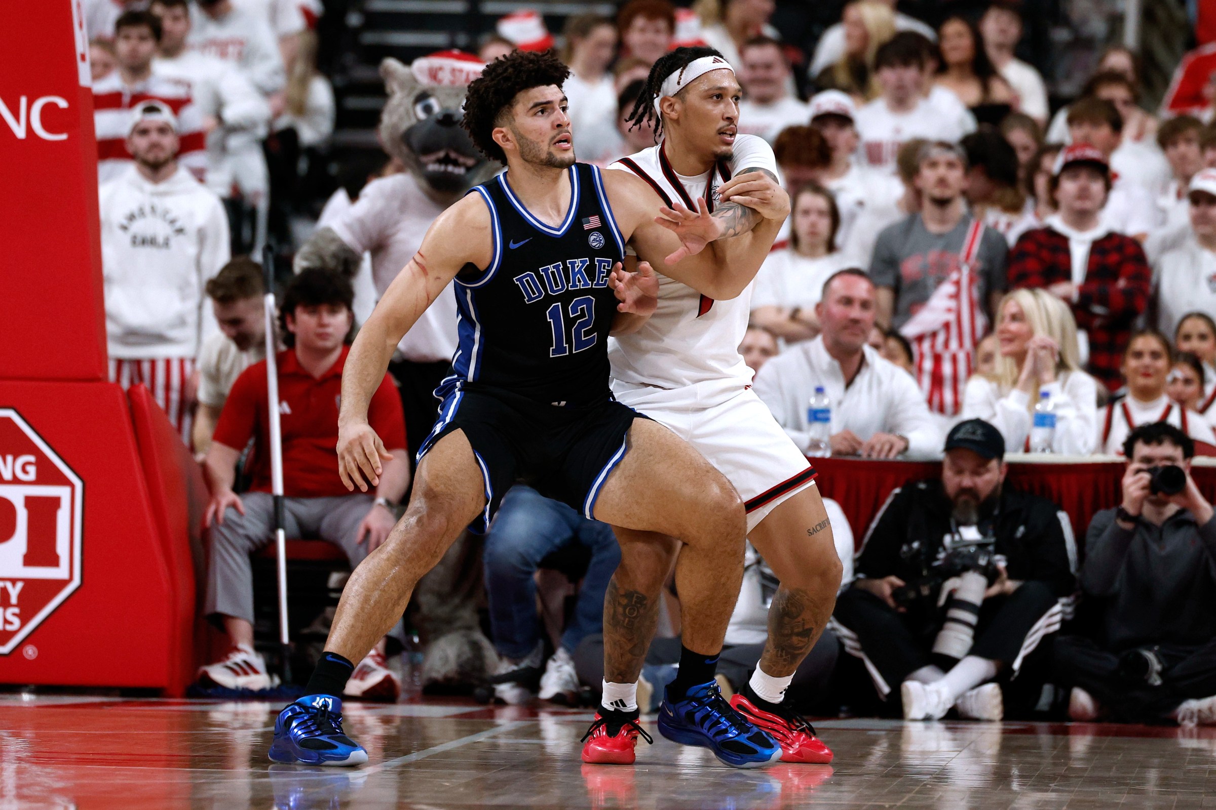 RALEIGH, NORTH CAROLINA - MARCH 2: Darrion Williams #1 of the NC State Wolfpack defends against Cameron Boozer #12 of the Duke Blue Devils at Lenovo Center on March 2, 2026 in Raleigh, North Carolina. (Photo by Lance King/Getty Images)
