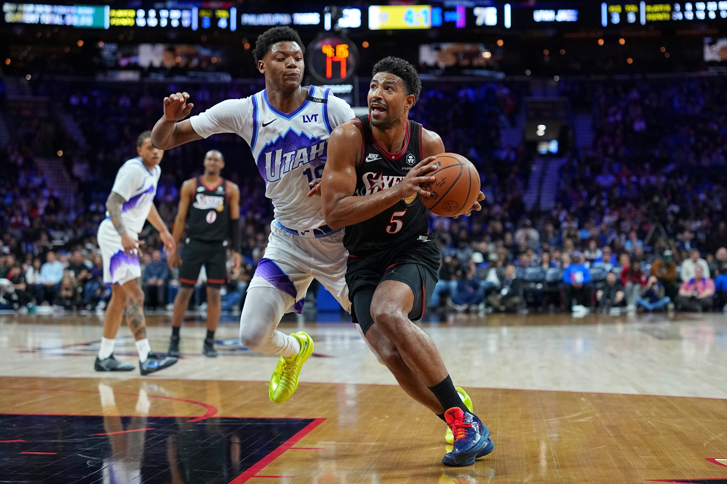 PHILADELPHIA, PENNSYLVANIA - MARCH 4: Quentin Grimes #5 of the Philadelphia 76ers drives to the basket against Ace Bailey #19 of the Utah Jazz in the third quarter at Xfinity Mobile Arena on March 4, 2026 in Philadelphia, Pennsylvania. The 76ers defeated the Jazz 106-102. NOTE TO USER: User expressly acknowledges and agrees that, by downloading and or using this photograph, User is consenting to the terms and conditions of the Getty Images License Agreement. (Photo by Mitchell Leff/Getty Images)