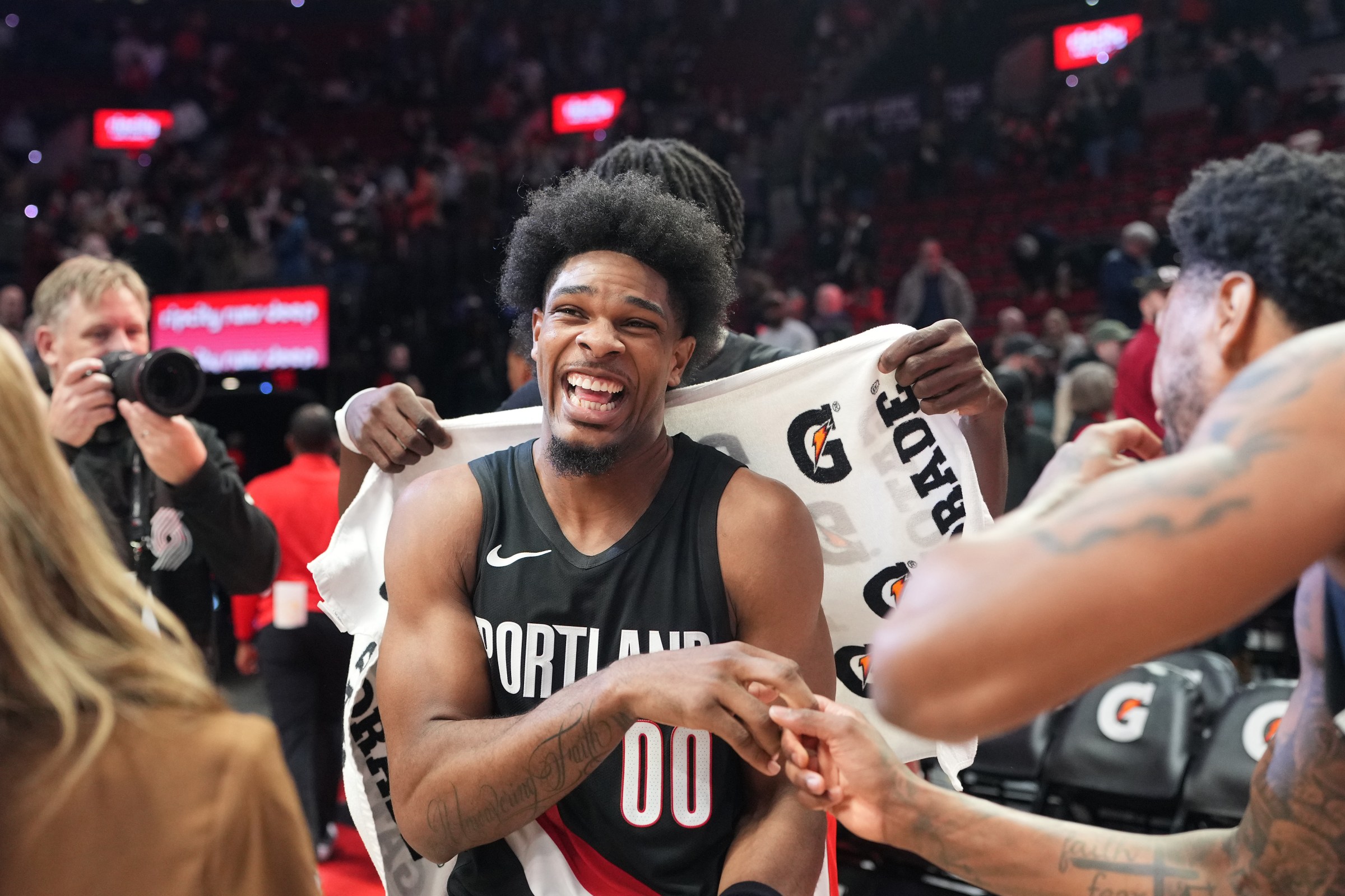 PORTLAND, OREGON - MARCH 08: Scoot Henderson #00 of the Portland Trail Blazers celebrates with teammates following a win against the Indiana Pacers at Moda Center on March 08, 2026 in Portland, Oregon. NOTE TO USER: User expressly acknowledges and agrees that, by downloading and or using this photograph, User is consenting to the terms and conditions of the Getty Images License Agreement. (Photo by Soobum Im/Getty Images)
