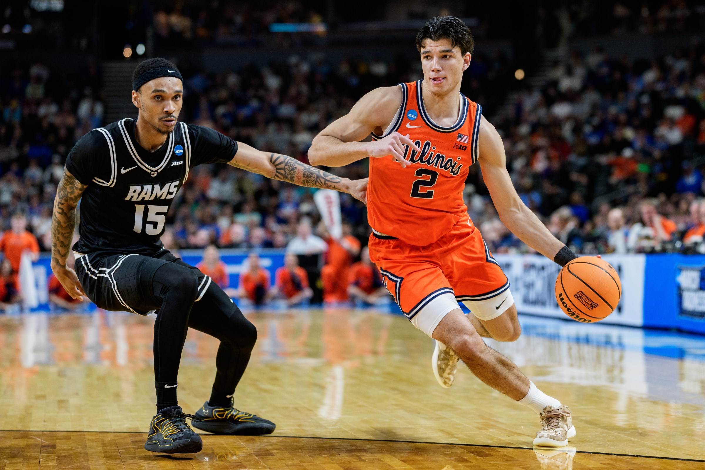 GREENVILLE, SOUTH CAROLINA - MARCH 21: Andrej Stojakovic #2 of the Illinois Fighting Illini brings the ball up court while guarded by Tyrell Ward #15 of the VCU Rams in the first half during the second round of the NCAA Men’s Basketball Tournament at Bon Secours Wellness Arena on March 21, 2026 in Greenville, South Carolina. (Photo by Jacob Kupferman/Getty Images)