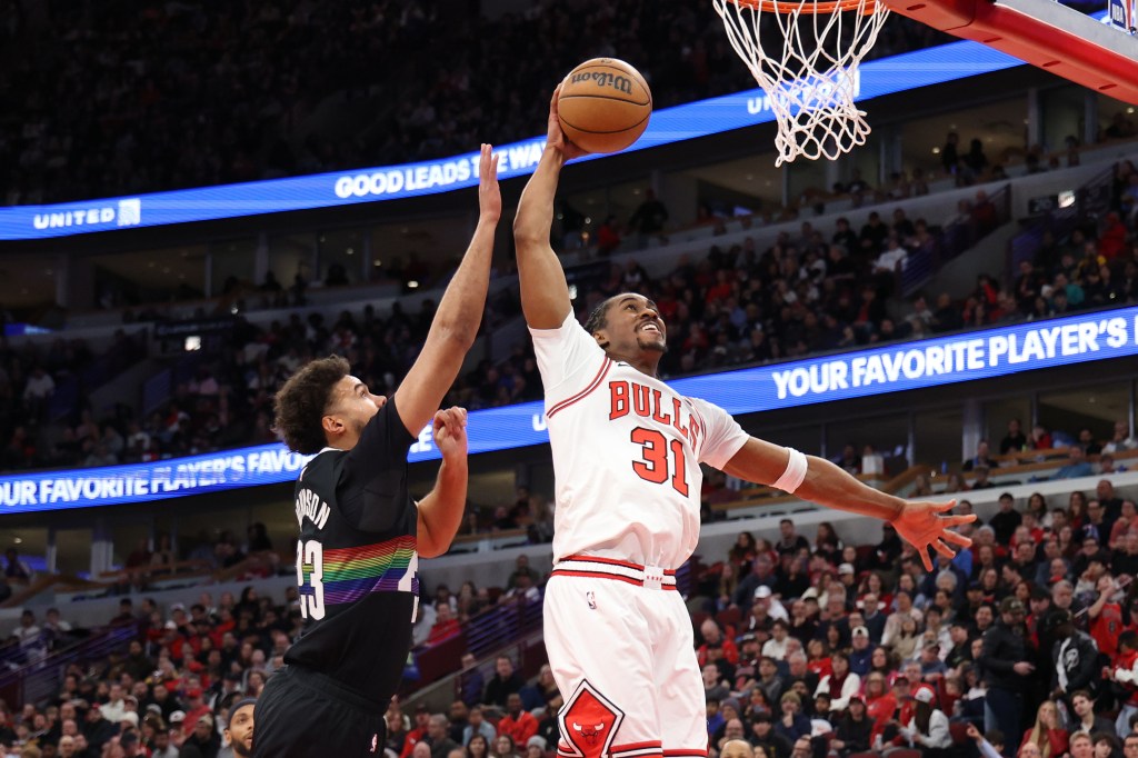 Jaden Ivey #31 of the Chicago Bulls attempts a dunk against Cameron Johnson #23 of the Denver Nuggets during the second quarter at the United Center on February 7, 2026 in Chicago, Illinois.  
