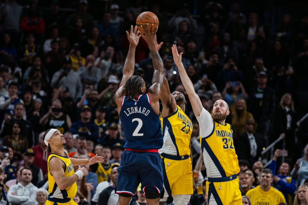 LA Clippers forward Kawhi Leonard (2) shoots the game winning shot against Indiana Pacers guard Aaron Nesmith (23), center Jay Huff (32) and guard Andrew Nembhard (2) in the second half at Gainbridge Fieldhouse.