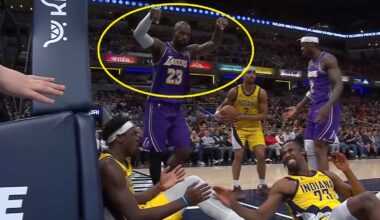 LeBron James pointing at two defenders