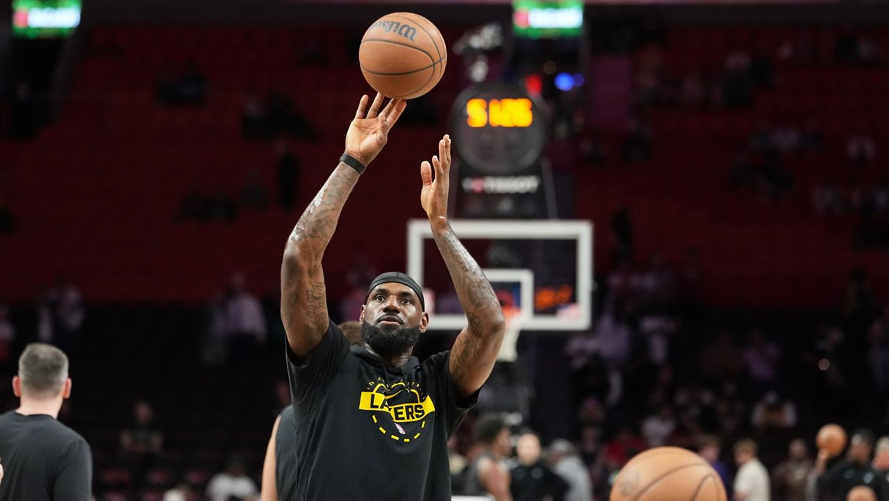 Los Angeles Lakers forward LeBron James warms up before an NBA basketball game against the Miami Heat, Thursday, March 19, 2026, in Miami. (AP Photo/Lynne Sladky)