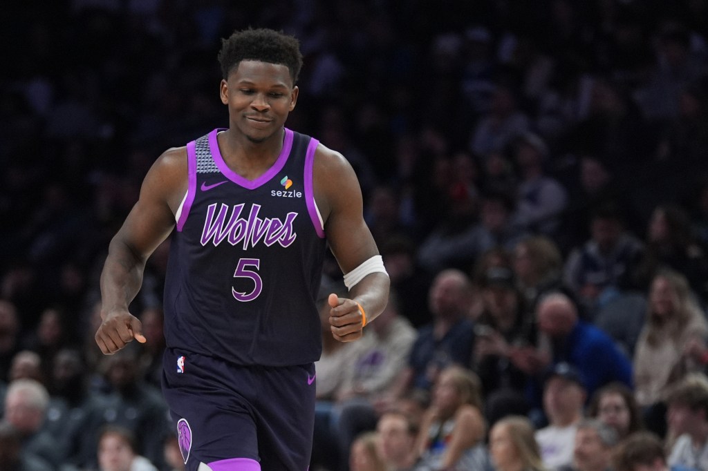 Minnesota Timberwolves guard Anthony Edwards reacting after missing a shot.