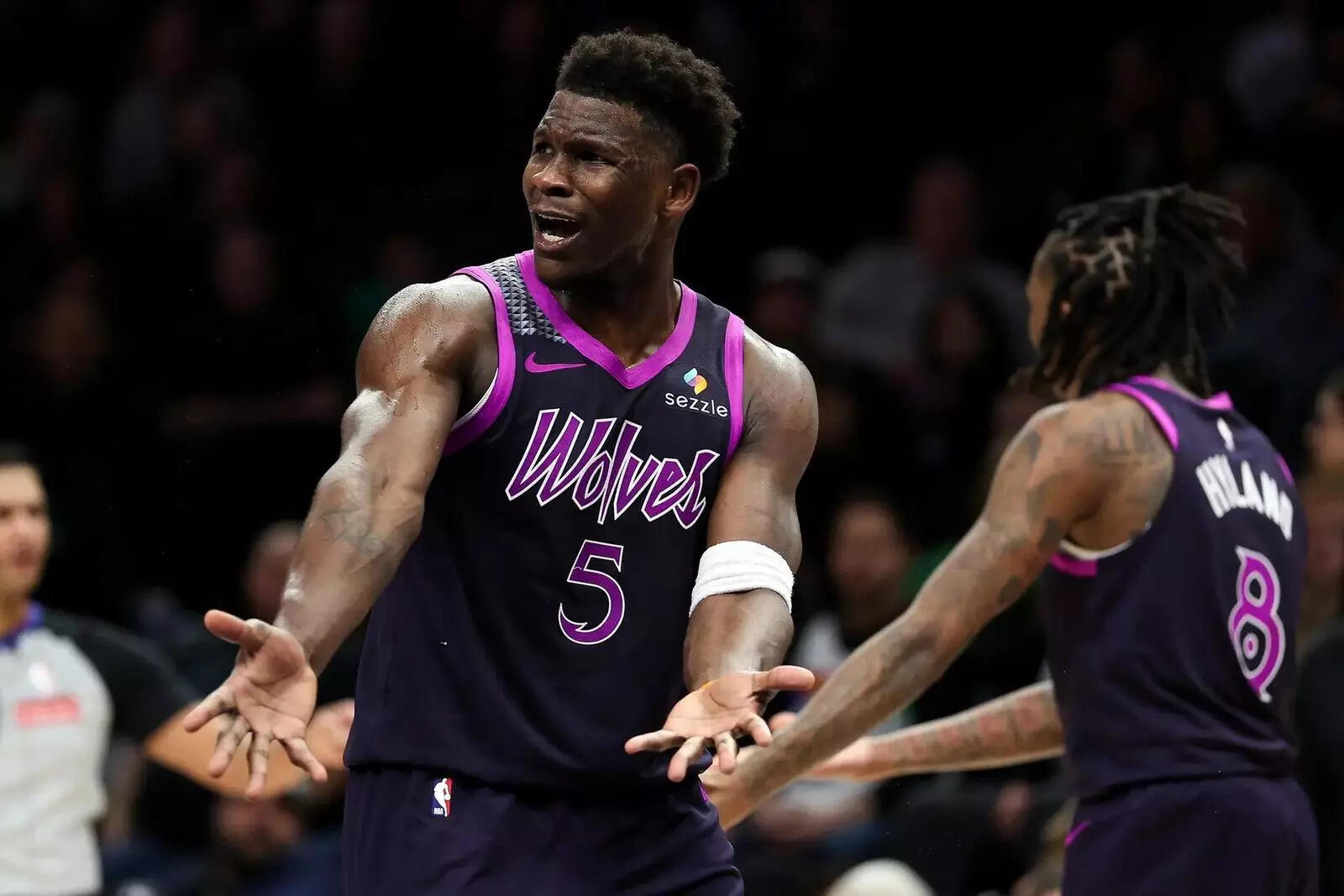 Minnesota Timberwolves guard Anthony Edwards (5) reacts to a call during the second half of an NBA basketball game against the Golden State Warriors