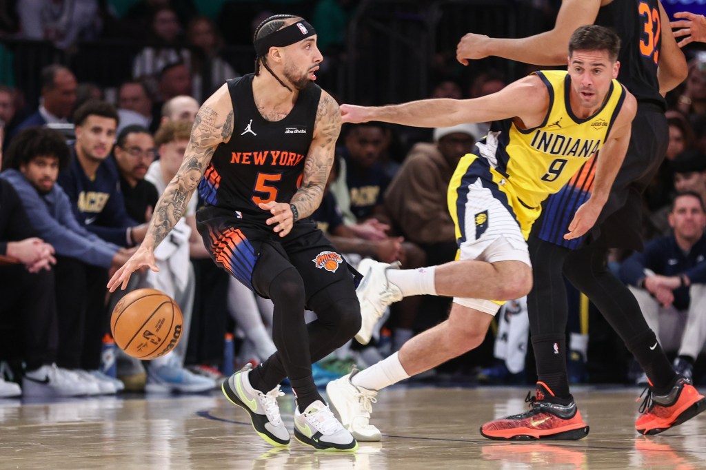 New York Knicks guard Jose Alvarado (5) driving past Indiana Pacers guard T.J. McConnell (9).
