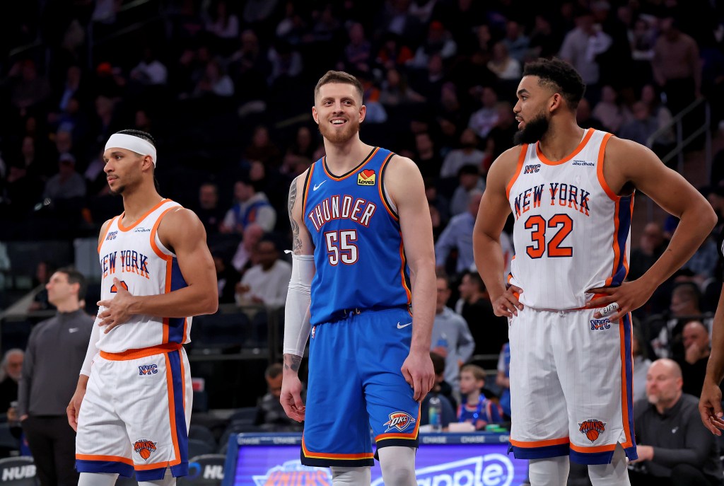Oklahoma City Thunder center Isaiah Hartenstein #55 is all smiles between New York Knicks guard Josh Hart #3 and New York Knicks center Karl-Anthony Towns #32 during the third quarter at Madison Square Garden.