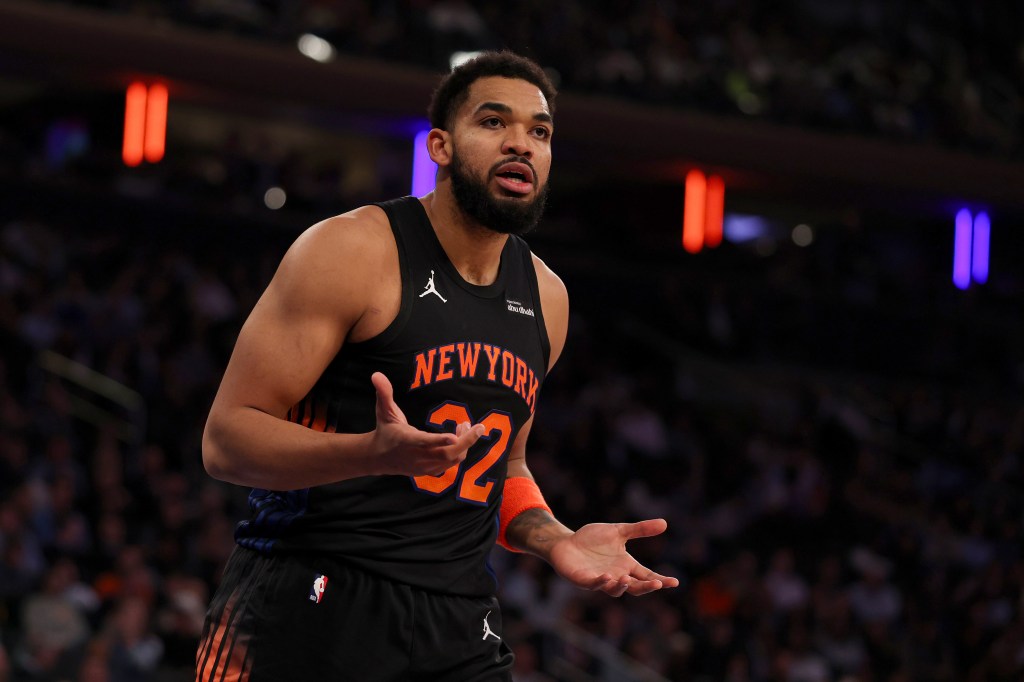 New York Knicks player Karl-Anthony Towns reacting to a foul call.