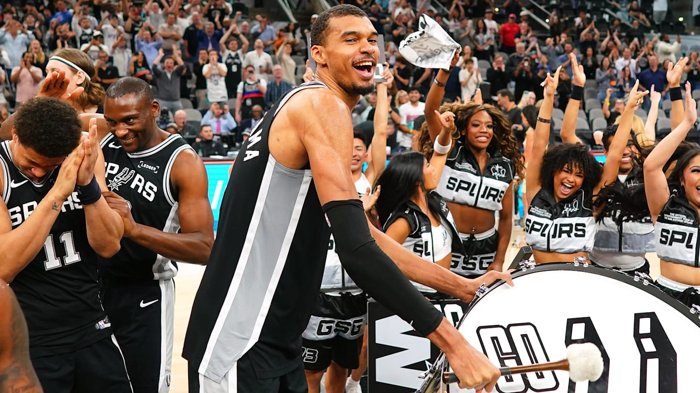 Mar 5, 2026; San Antonio, Texas, USA; San Antonio Spurs forward forward Victor Wembanyama (1) beats a drum and leads fans on a cheer after a victory over the Detroit Pistons at Frost Bank Center. Mandatory Credit: Scott Wachter-Imagn Images