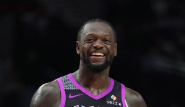 Feb 24, 2026; Portland, Oregon, USA; Minnesota Timberwolves forward Julius Randle (30) and Portland Trail Blazers guard Jrue Holiday (5) share a laugh during the second half at Moda Center. Mandatory Credit: Soobum Im-Imagn Images