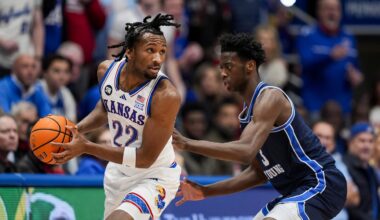 Jan 24, 2026; Columbia, Missouri, USA; Kansas Jayhawks guard Darryn Peterson (22) looks to pass against BYU Cougars forward AJ Dybantsa (3) during the first half at Mizzou Arena. Mandatory Credit: Jay Biggerstaff-Imagn Images