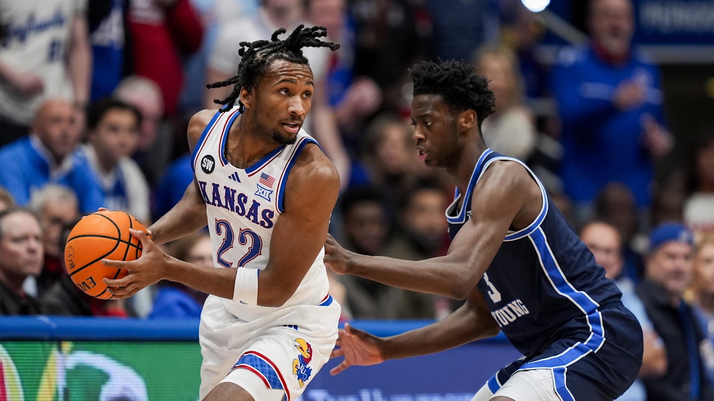 Jan 24, 2026; Columbia, Missouri, USA; Kansas Jayhawks guard Darryn Peterson (22) looks to pass against BYU Cougars forward AJ Dybantsa (3) during the first half at Mizzou Arena. Mandatory Credit: Jay Biggerstaff-Imagn Images