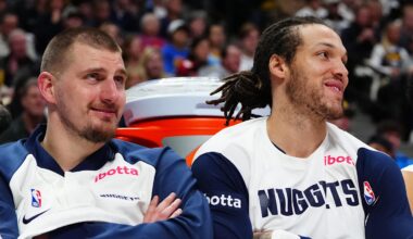 Dec 23, 2024; Denver, Colorado, USA; Denver Nuggets center Nikola Jokic (15) and forward Aaron Gordon (32) and forward Michael Porter Jr. (1) on the bench in the fourth quarter against the Phoenix Suns at Ball Arena. Mandatory Credit: Ron Chenoy-Imagn Images
