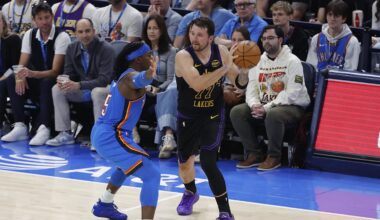 Apr 2, 2026; Oklahoma City, Oklahoma, USA; Los Angeles Lakers guard Luka Doncic (77) passes around Oklahoma City Thunder guard Luguentz Dort (5) during the second quarter at Paycom Center. Mandatory Credit: Alonzo Adams-Imagn Images