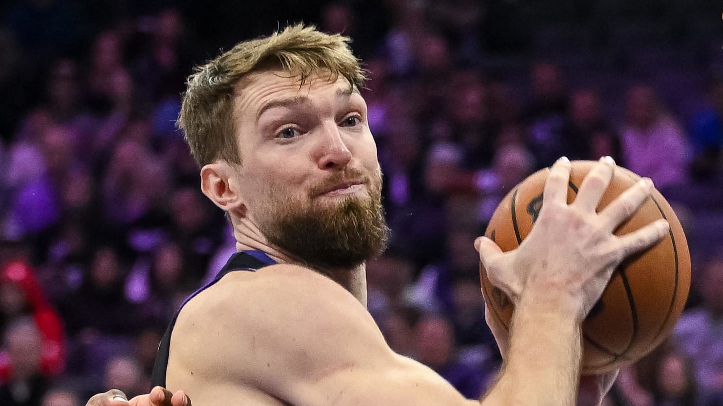 Feb 4, 2026; Sacramento, California, USA; Sacramento Kings forward/center Domantas Sabonis (11) rebounds tagainst Memphis Grizzlies guard Cedric Coward (23) during the third quarter at Golden 1 Center. Mandatory Credit: Ed Szczepanski-Imagn Images