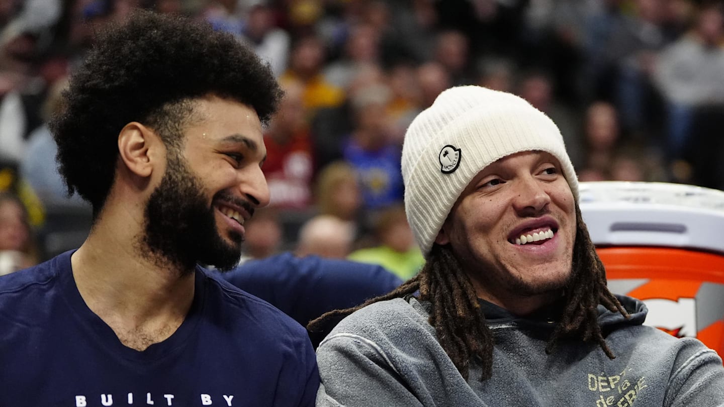 Feb 3, 2025; Denver, Colorado, USA; Denver Nuggets forward Aaron Gordon (32) and guard Jamal Murray (27) on the bench in the second half against the New Orleans Pelicans at Ball Arena. Mandatory Credit: Ron Chenoy-Imagn Images
