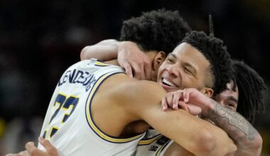 Michigan Wolverines forward Yaxel Lendeborg (23) and Wolverines guard Trey McKenney (1)