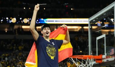 Apr 6, 2026; Indianapolis, IN, USA; Michigan Wolverines center Aday Mara (15) celebrates after cutting down a piece of the net after defeating the Connecticut Huskies in the national championship of the Final Four of the men's 2026 NCAA Tournament at Lucas Oil Stadium. Mandatory Credit: Robert Deutsch-Imagn Images