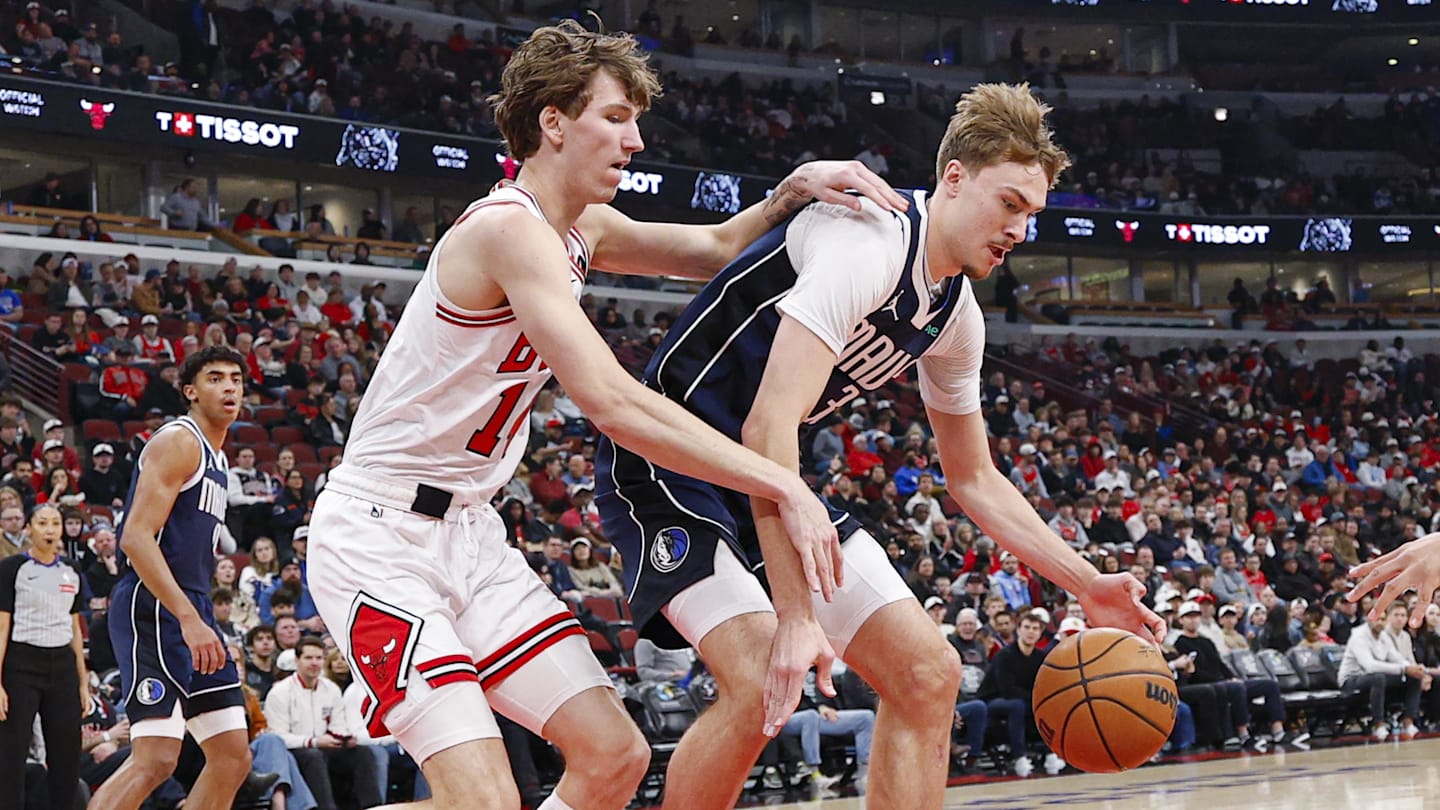 Jan 10, 2026; Chicago, Illinois, USA; Dallas Mavericks forward Cooper Flagg (32) defends against Chicago Bulls forward Matas Buzelis (14) during the first half at United Center. Mandatory Credit: Kamil Krzaczynski-Imagn Images