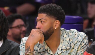 Mar 30, 2026; Los Angeles, California, USA; Washington Wizards forward Anthony Davis (23), center, looks on from the bench during the first half against the Los Angeles Lakers at Crypto.com Arena. Mandatory Credit: Jayne Kamin-Oncea-Imagn Images