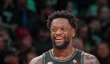 Feb 9, 2026; Minneapolis, Minnesota, USA; Minnesota Timberwolves forward Julius Randle (30) and guard Anthony Edwards (5) laugh after a timeout against the Atlanta Hawks in the fourth quarter at Target Center. Mandatory Credit: Brad Rempel-Imagn Images