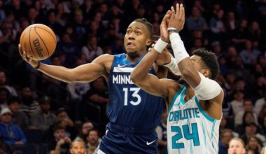 Apr 5, 2026; Minneapolis, Minnesota, USA; Minnesota Timberwolves guard Ayo Dosunmu (13) shoots as Charlotte Hornets forward Brandon Miller (24) defends in the second quarter at Target Center. Mandatory Credit: Matt Blewett-Imagn Images