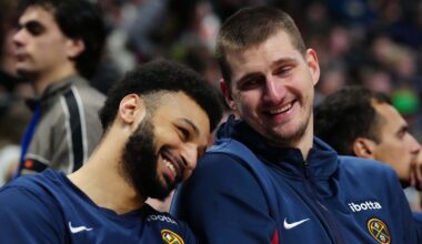 Dec 28, 2023; Denver, Colorado, USA; Denver Nuggets center Nikola Jokic (15) and guard Jamal Murray (27) react on the bench during the fourth quarter against the Memphis Grizzlies at Ball Arena. Mandatory Credit: Ron Chenoy-Imagn Images