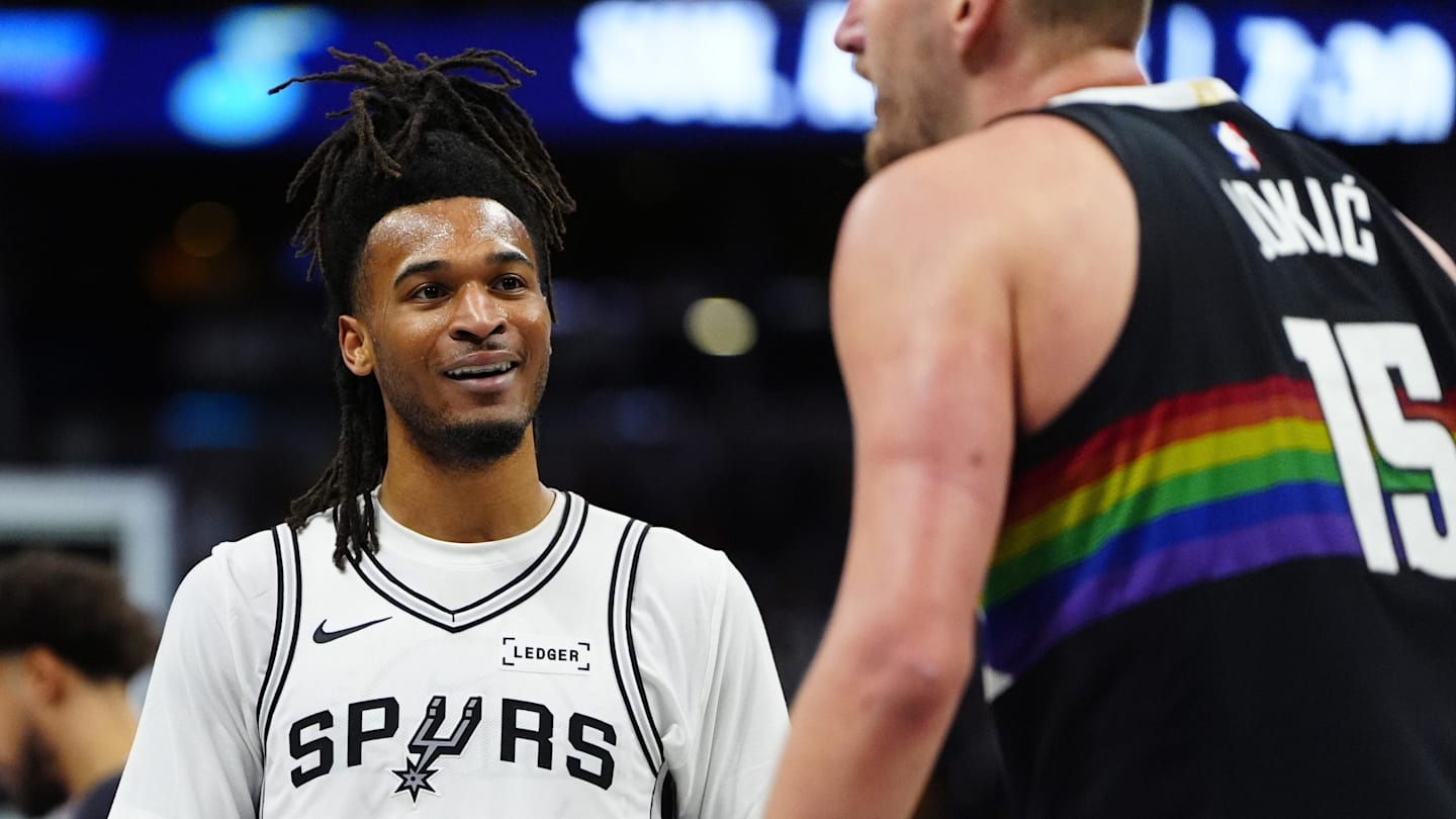 Apr 4, 2026; Denver, Colorado, USA; San Antonio Spurs guard Stephon Castle (5) reacts towards Denver Nuggets center Nikola Jokic (15) in the third quarter at Ball Arena. Mandatory Credit: Ron Chenoy-Imagn Images