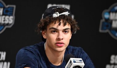 Illinois Fighting Illini guard Keaton Wagler (23) speaks in a press conference after defeating the Iowa Hawkeyes in an Elite Eight game of the South Regional of the men's 2026 NCAA Tournament at Toyota Center on March 28, 2026.