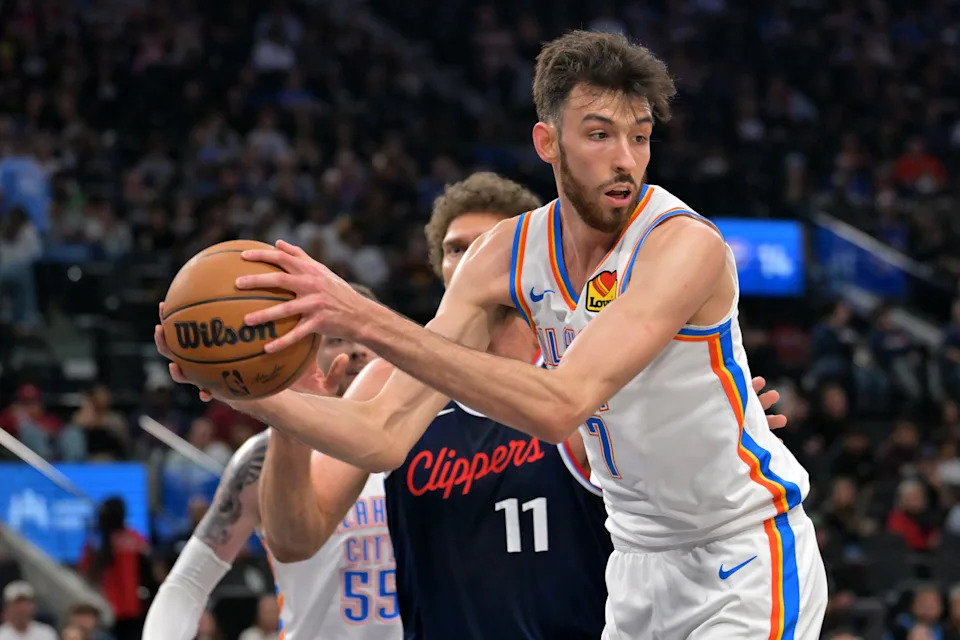Apr 8, 2026; Inglewood, California, USA; Oklahoma City Thunder center Chet Holmgren (7) reaches in front of Los Angeles Clippers center Brook Lopez (11) for a rebound in the first half at Intuit Dome. Mandatory Credit: Jayne Kamin-Oncea-Imagn Images