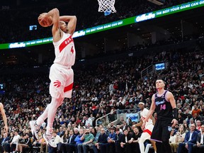 Toronto Raptors' Scottie Barnes (4) dunks against the Miami Heat during Tuesday's game.