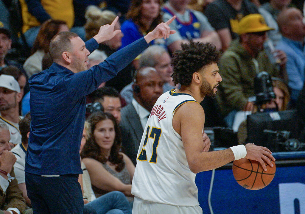 Denver Nuggets Head Coach David Adelman gives instruction while Denver Nuggets guard Jamal Murray (27) takes the ball down the court during game 1 of round 1 of the NBA Championships at Ball Arena on Saturday, April 19, 2026. The Nuggets won the game 116-105. (The Gazette, Jerilee Bennett)