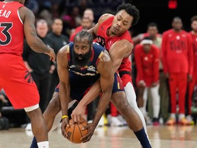 Cleveland Cavaliers guard James Harden keeps the ball fron Toronto Raptors forward Scottie Barnes during Game 2 of their NBA playoff series.