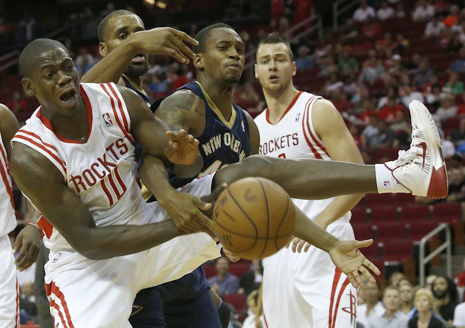 HOUSTON, TX - OCTOBER 05: Ronnie Brewer #10 of the Houston Rockets and Lance Thomas #42 of the New Orleans Pelicans battle for a rebound in a preseason NBA game on October 5, 2013 at Toyota Center in Houston, Texas. The Pelicans won 116-115. NOTE TO USER: User expressly acknowledges and agrees that, by downloading and or using this photograph, User is consenting to the terms and conditions of the Getty Images License Agreement. (Photo by Thomas B. Shea/Getty Images)