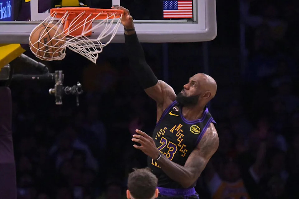 Los Angeles, California, USA; Los Angeles Lakers forward LeBron James (23) dunks in the second half against the Cleveland Cavaliers at Crypto.com Arena. Mandatory Credit: Jayne Kamin-Oncea-Imagn Images