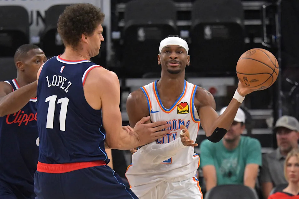 Apr 8, 2026; Inglewood, California, USA; Los Angeles Clippers center Brook Lopez (11) defends Oklahoma City Thunder guard Shai Gilgeous-Alexander (2) in the first half at Intuit Dome. Mandatory Credit: Jayne Kamin-Oncea-Imagn Images