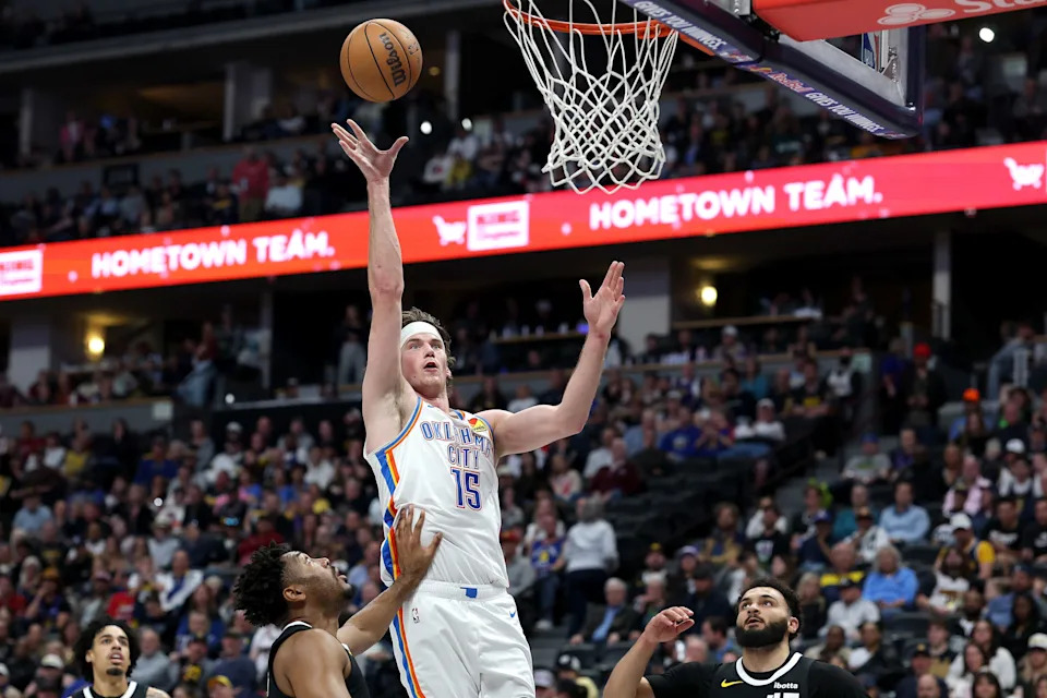 DENVER, COLORADO - APRIL 10: Branden Carlson #15 of the Oklahoma City Thunder puts up a shot against Jalen Pickett #24 and David Roddy #45 of the Denver Nuggets during the fourth quarter at Ball Arena on April 10, 2026 in Denver, Colorado. NOTE TO USER: User expressly acknowledges and agrees that, by downloading and or using this photograph, User is consenting to the terms and conditions of the Getty Images License Agreement. (Photo by Matthew Stockman/Getty Images)