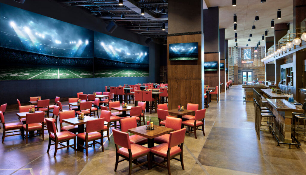 The Mountain Pass Sports Bar and its gargantuan screen at the Gaylord Rockies Resort. (Provided by The Gaylord Rockies Resort)