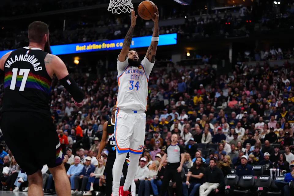 Apr 10, 2026; Denver, Colorado, USA; Oklahoma City Thunder guard Kenrich Williams (34) grabs a rebound in the first quarter against the Denver Nuggets at Ball Arena. Mandatory Credit: Ron Chenoy-Imagn Images