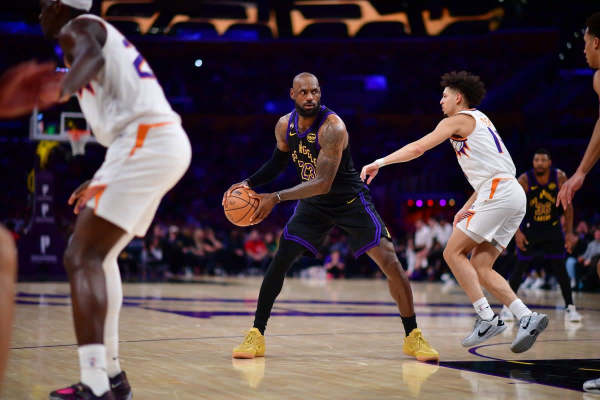 Los Angeles Lakers forward LeBron James (23) controls the ball against Phoenix Suns guard Koby Brea (14) (IMAGN IMAGES via Reuters Connect)