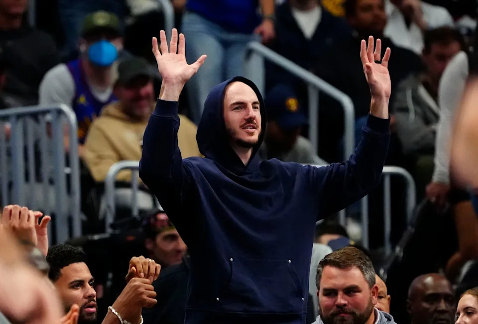 Apr 10, 2026; Denver, Colorado, USA; Oklahoma City Thunder guard Alex Caruso (9) reacts from the bench in the second half against the Denver Nuggets at Ball Arena. Mandatory Credit: Ron Chenoy-Imagn Images