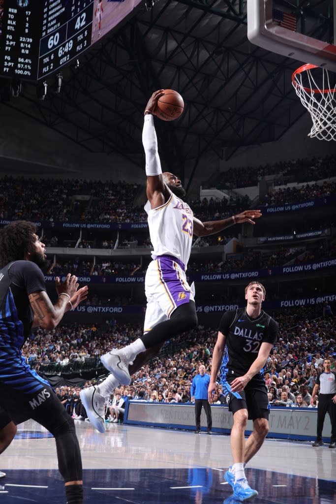 LeBron James of the Los Angeles Lakers dunks the ball during the game against the Dallas Mavericks. NBAE via Getty Images