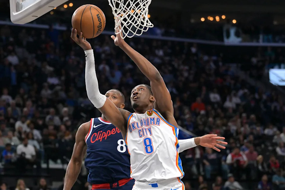 Apr 8, 2026; Inglewood, California, USA; Los Angeles Clippers guard Kris Dunn (8) defends Oklahoma City Thunder guard Jalen Williams (8) as he drives to the basket in the second half at Intuit Dome. Mandatory Credit: Jayne Kamin-Oncea-Imagn Images
